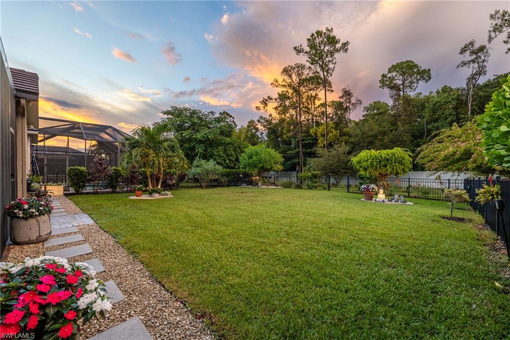 3620 Pilot Circle Naples, FL 34120 - Photo 38 of 49 a front view of a house with garden