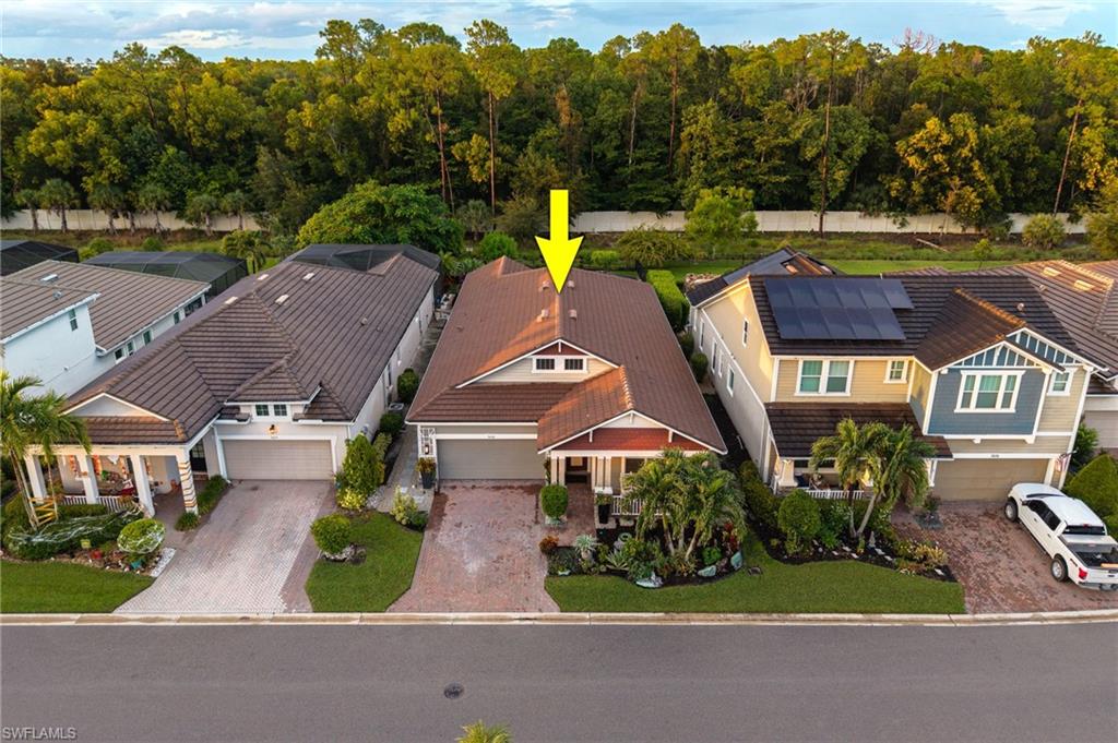 3620 Pilot Circle Naples, FL 34120 - Photo 40 of 49 a aerial view of a house with a garden and a yard