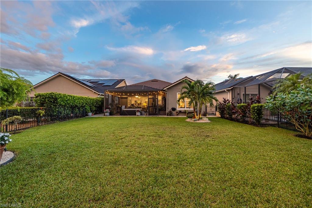 3620 Pilot Circle Naples, FL 34120 - Photo 44 of 49 a front view of a house with a yard