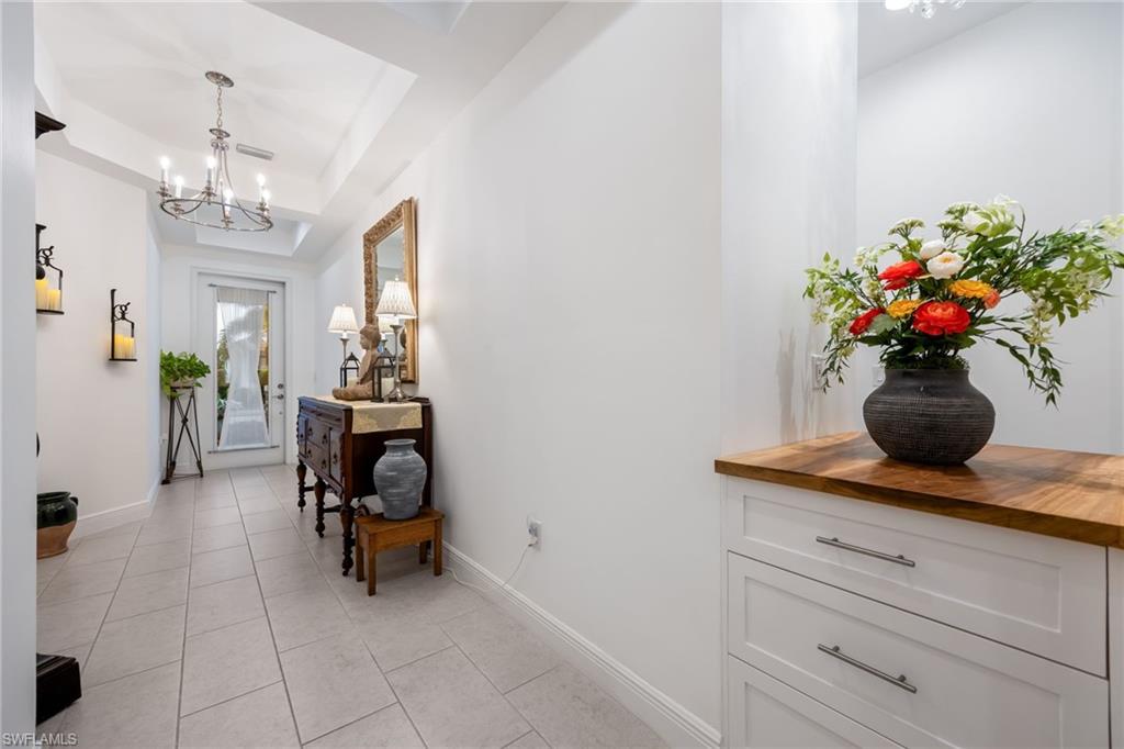 3620 Pilot Circle Naples, FL 34120 - Photo 5 of 49 a living room with furniture and a chandelier