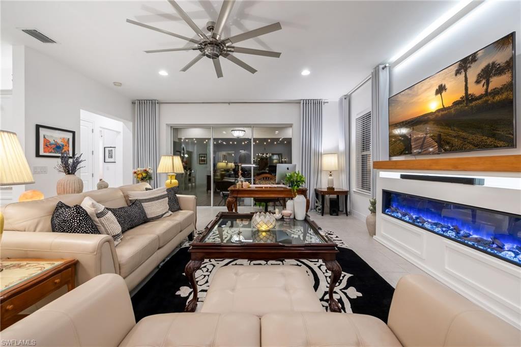 3620 Pilot Circle Naples, FL 34120 - Photo 9 of 49 a living room with furniture and a flat screen tv