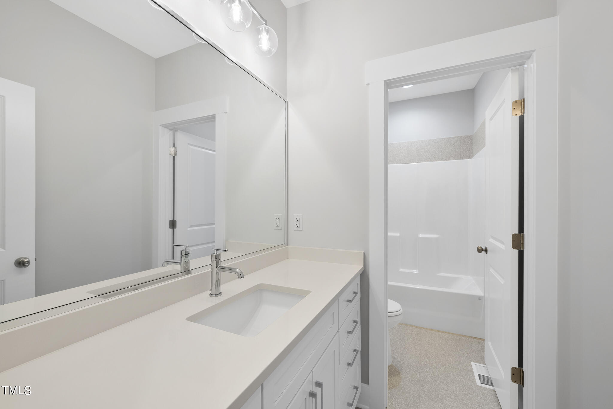100 Pilot Ridge Road Zebulon, NC 27597 - Photo 23 of 29 a bathroom with a sink and a mirror