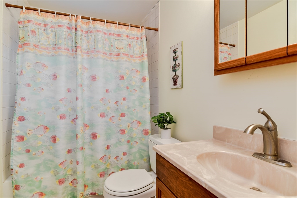 10 Kelsey Road Natick, MA 01760 - Photo 13 of 24 a bathroom with a sink toilet and shower