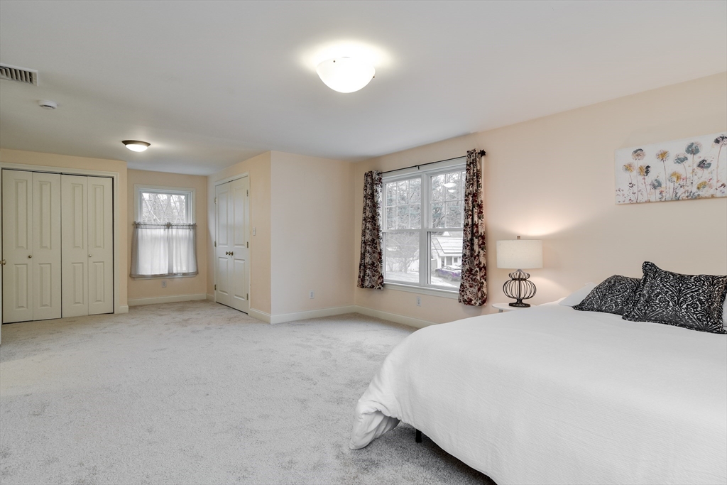 10 Kelsey Road Natick, MA 01760 - Photo 18 of 24 a bedroom with a bed and a window