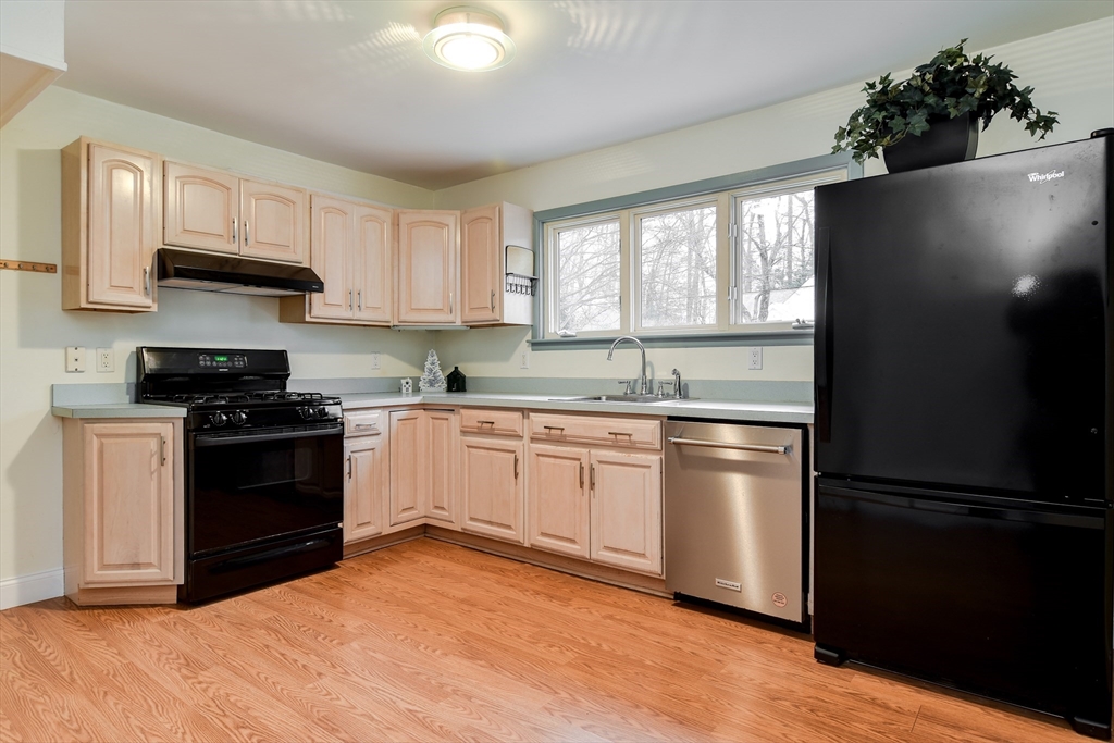 10 Kelsey Road Natick, MA 01760 - Photo 10 of 24 a kitchen with a refrigerator stove top oven and sink