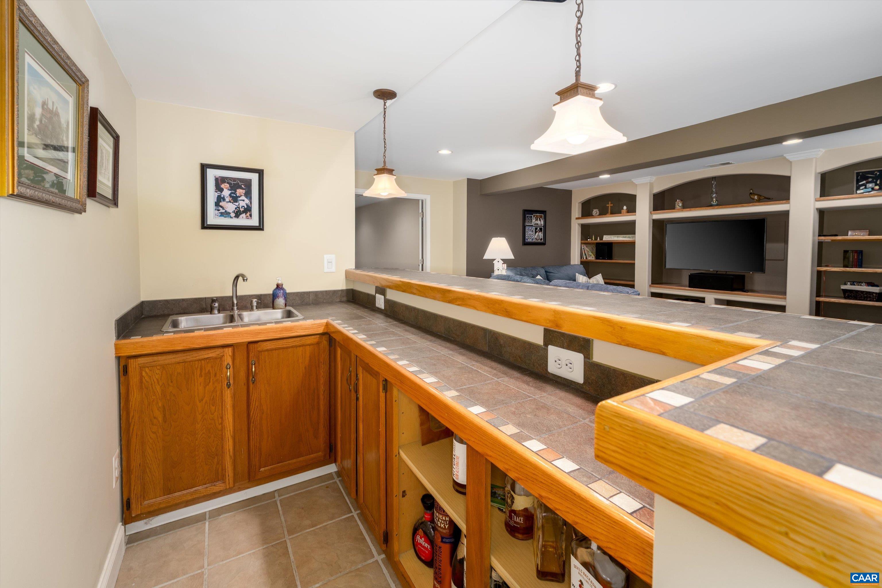 5366 Park Road Crozet, VA 22932 - Photo 52 of 61 a kitchen with stainless steel appliances granite countertop a sink and a microwave