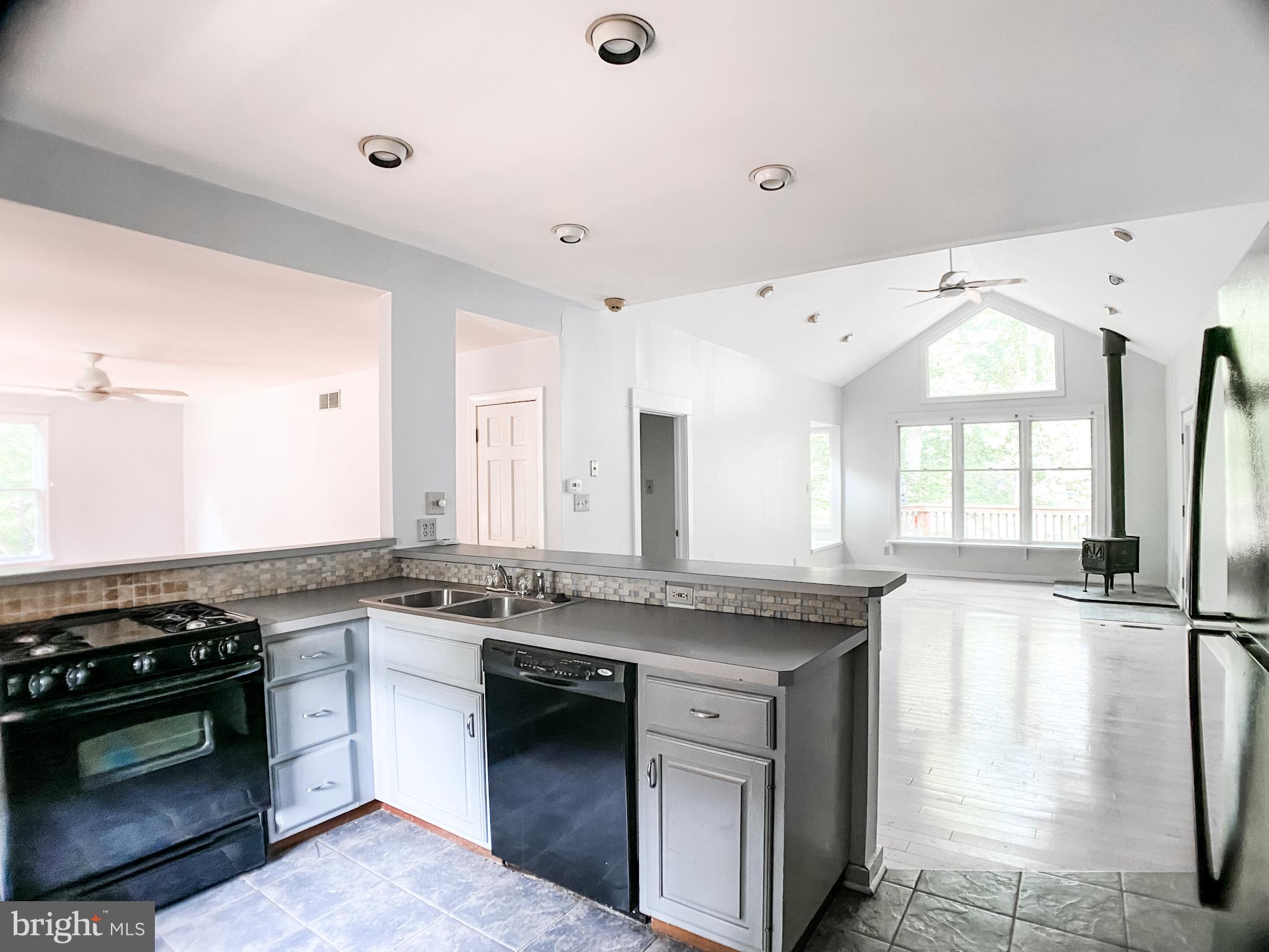 651 Lake Boulevard Lindenwold, NJ 08021 - Photo 14 of 37 a kitchen with stainless steel appliances granite countertop a stove and a sink