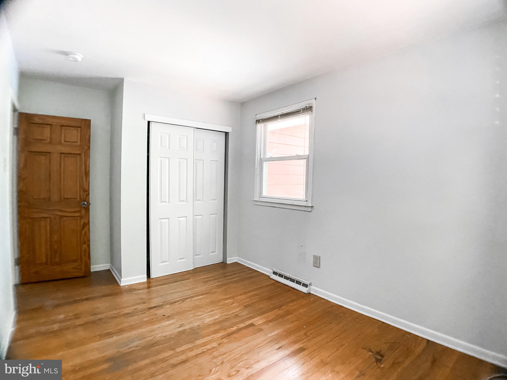 651 Lake Boulevard Lindenwold, NJ 08021 - Photo 24 of 37 an empty room with wooden floor and windows