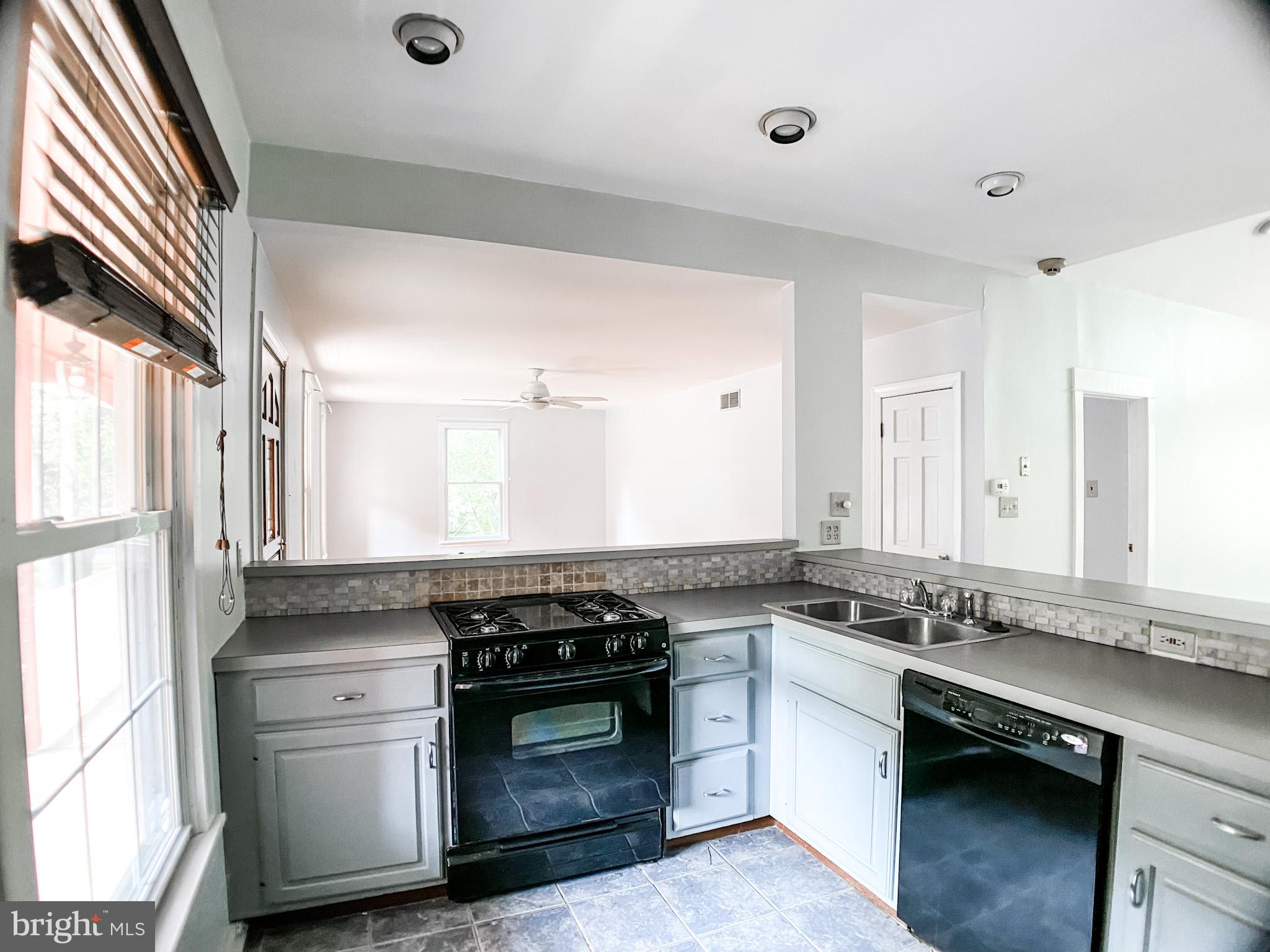 651 Lake Boulevard Lindenwold, NJ 08021 - Photo 8 of 37 a kitchen with stainless steel appliances granite countertop a stove and a sink