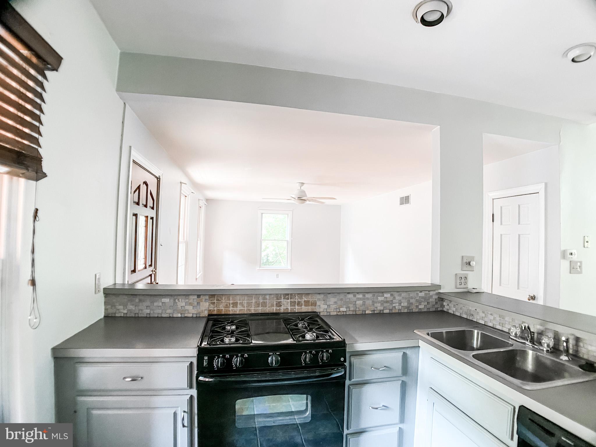 651 Lake Boulevard Lindenwold, NJ 08021 - Photo 9 of 37 a kitchen with a sink stove and cabinets