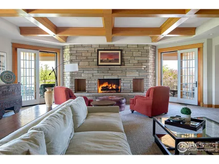 a living room with furniture and a window with outer view