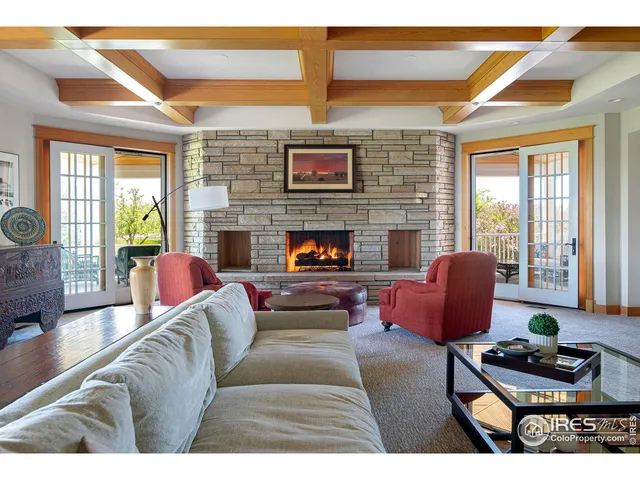 a living room with furniture and a window with outer view