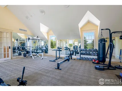 a spacious bedroom with a large bed and a large window