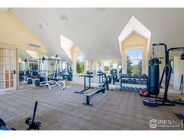 a spacious bedroom with a large bed and a large window