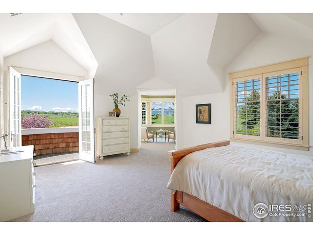 a view of swimming pool with outdoor seating and city view