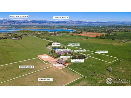 a front view of residential houses with yard and car parked