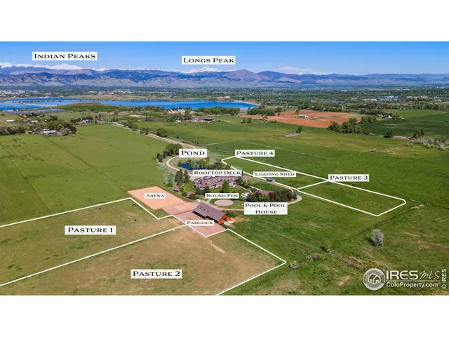 a front view of residential houses with yard and car parked