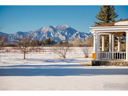 a view of a house with a snow on the road