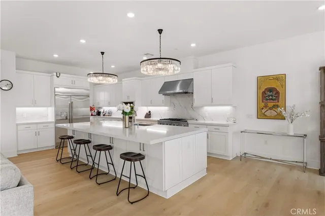 a kitchen with cabinets a sink and appliances