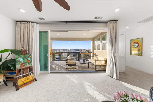 a view of a balcony with wooden benches