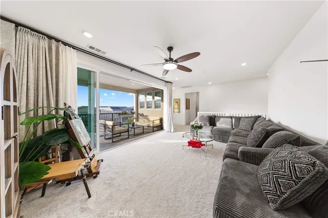 a view of a house with pool and chairs