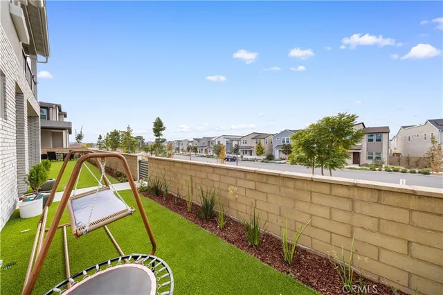 an aerial view of a house with outdoor space