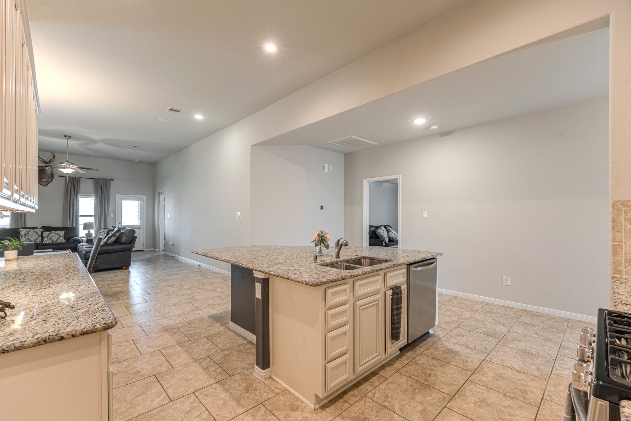 14207 Irvine Rnch Trail Conroe, TX 77384 - Photo 10 of 29 a kitchen with a sink and cabinets