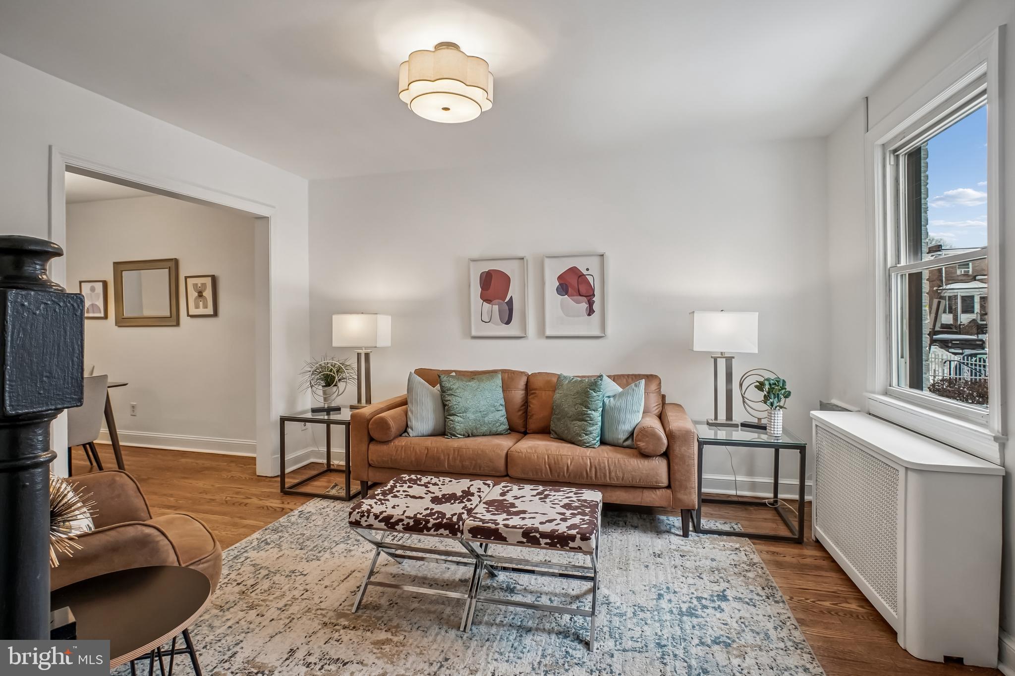423 20th Street Northeast Washington, DC 20002 - Photo 11 of 35 a living room with furniture wooden floor and wall paintings