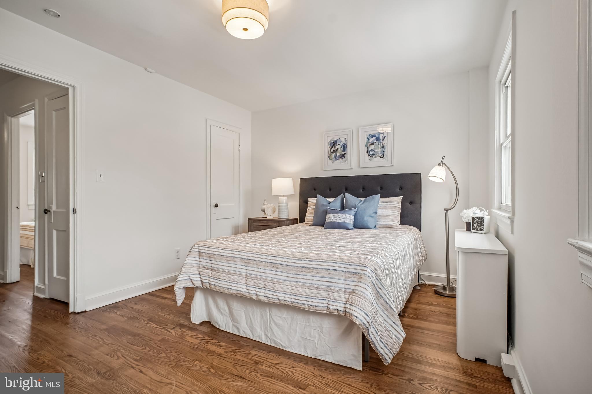 423 20th Street Northeast Washington, DC 20002 - Photo 25 of 35 a bedroom with a bed and wooden floor