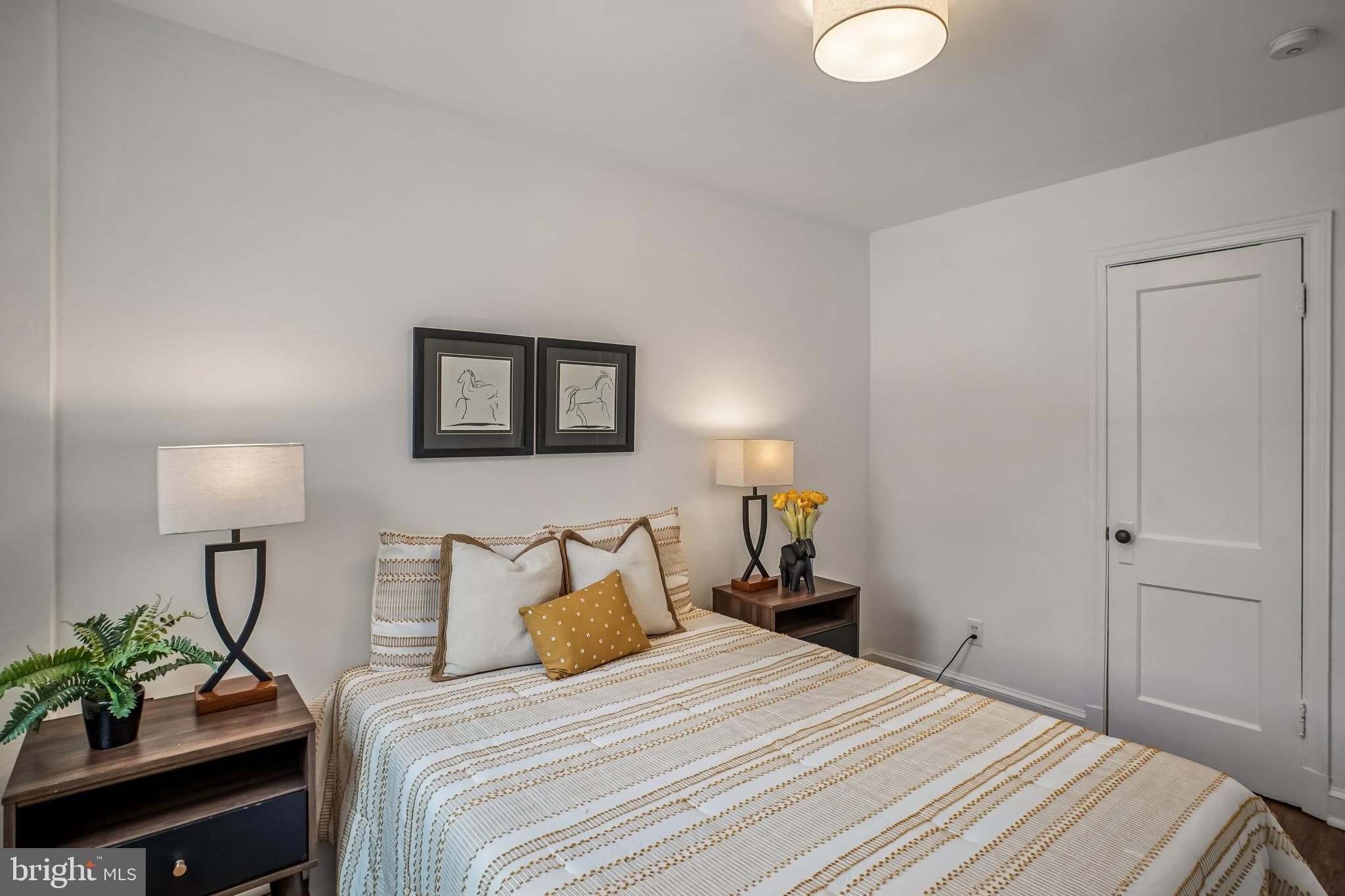 423 20th Street Northeast Washington, DC 20002 - Photo 30 of 35 a bedroom with a bed and a lamp