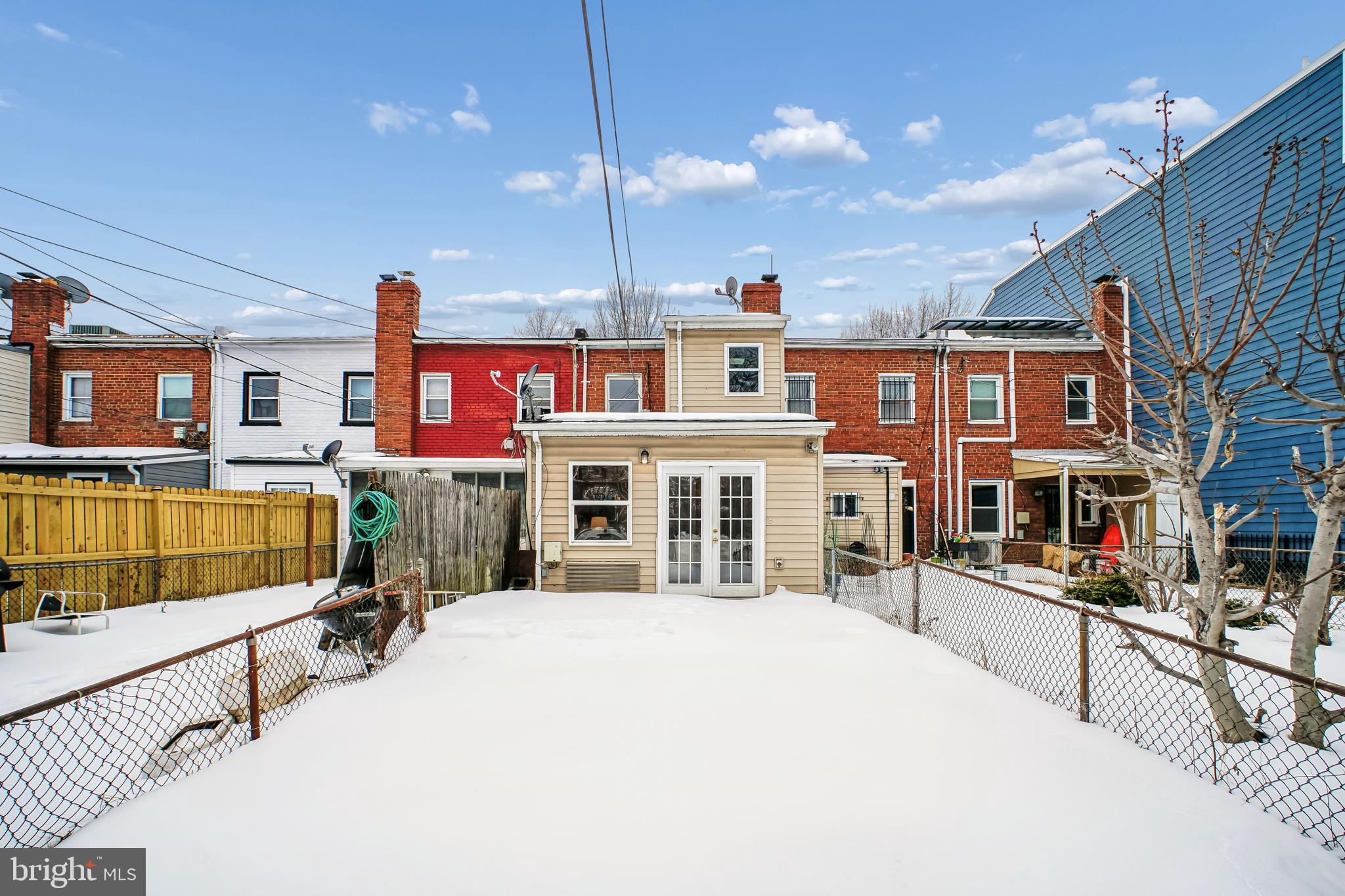 423 20th Street Northeast Washington, DC 20002 - Photo 32 of 35 a large building with a lot of windows and yard