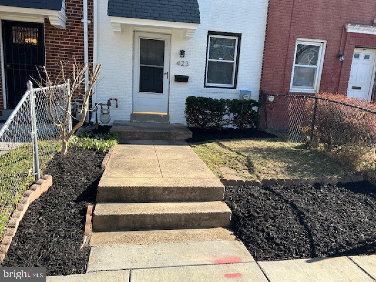 423 20th Street Northeast Washington, DC 20002 - Photo 4 of 35 a front view of a house with a yard