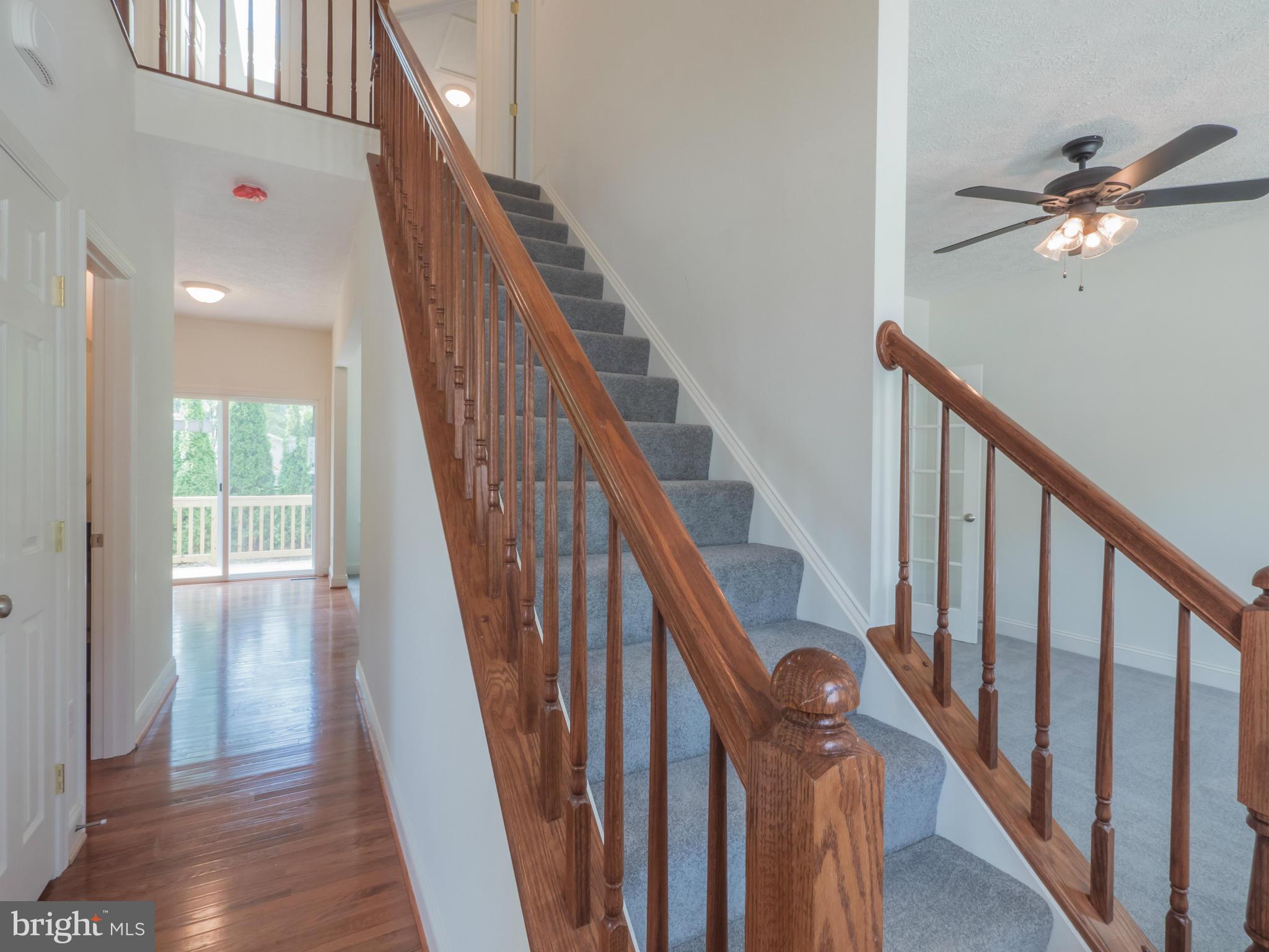 76 Bean Road Dowell, MD 20688 - Photo 22 of 30 a view of staircase with wooden floor and fan