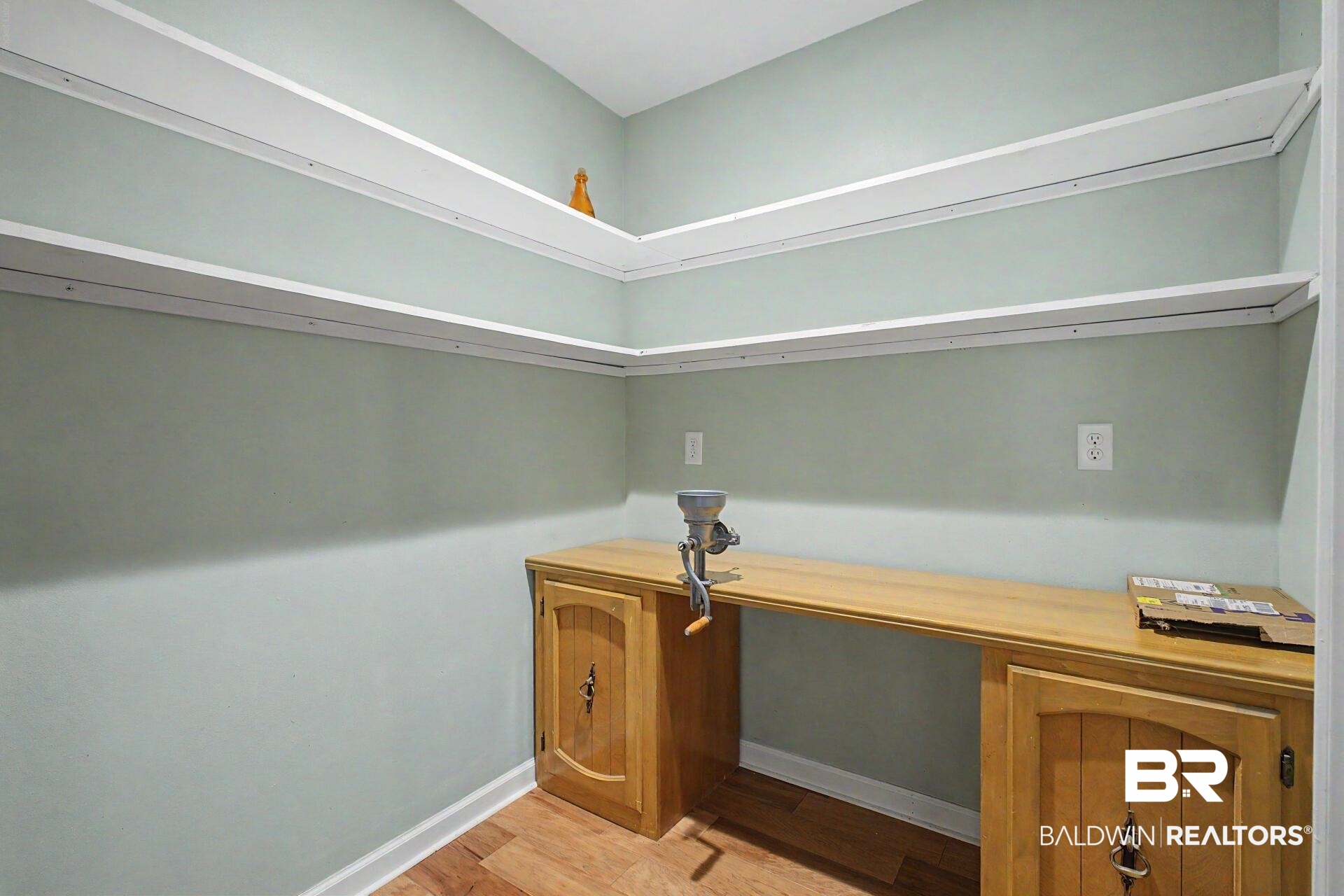 3791 Robinsonville Road Atmore, AL 36502 - Photo 27 of 47 Built-in cabinetry with a light wood-finish countertop, complemented by overhead shelving