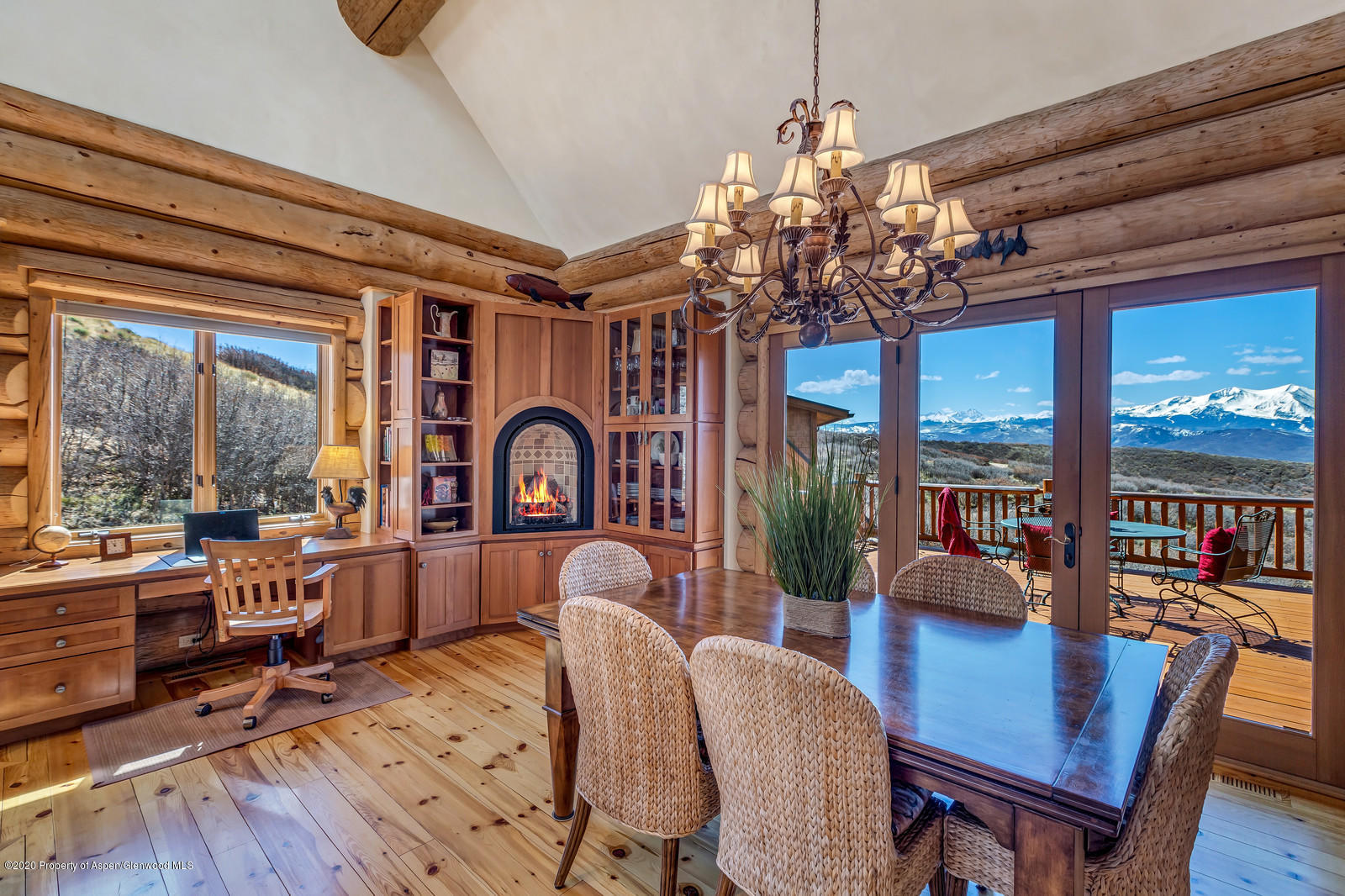1121 Spring Park Road Carbondale, CO 81623 - Photo 11 of 41 a view of a dining room with furniture a chandelier and wooden floor