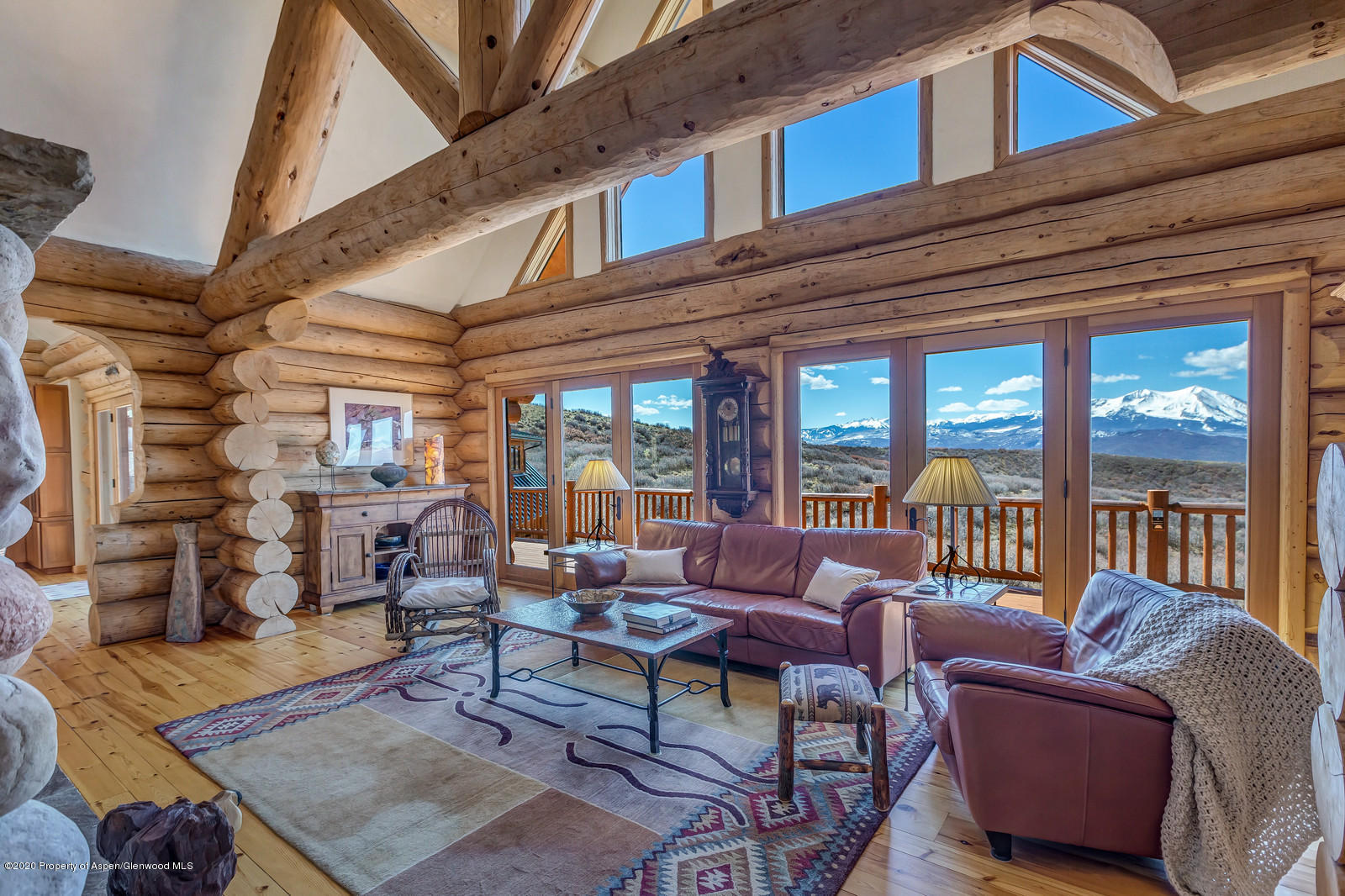 1121 Spring Park Road Carbondale, CO 81623 - Photo 2 of 41 a living room with furniture a rug and a large window