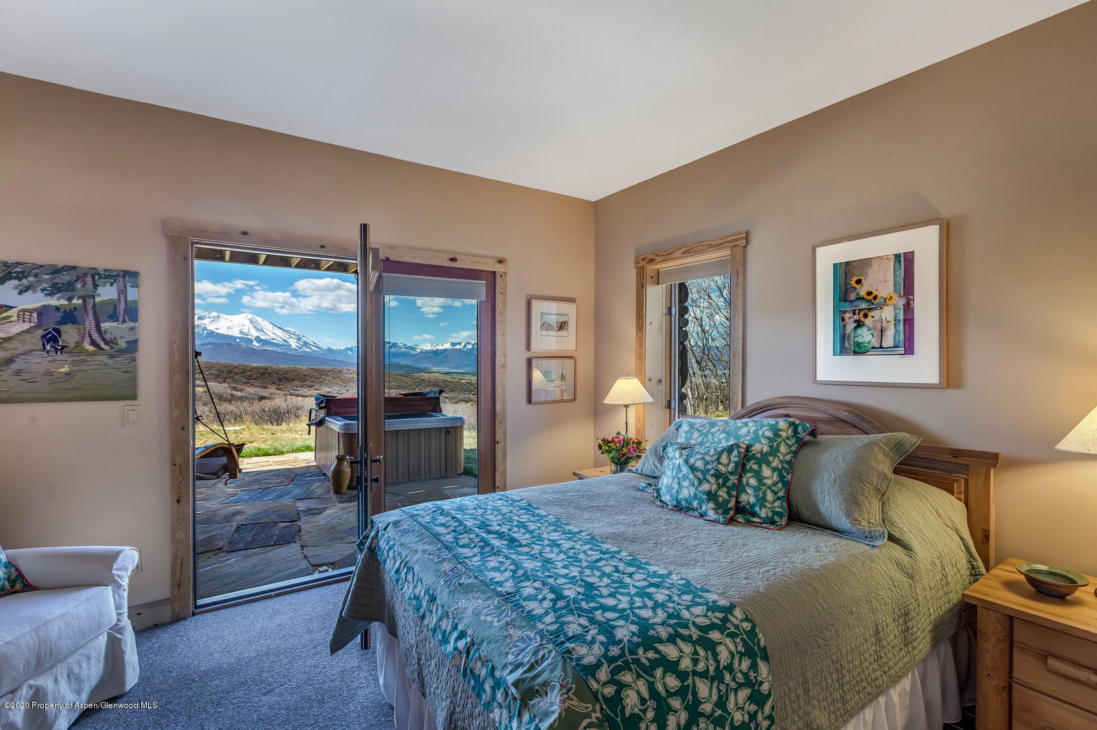 1121 Spring Park Road Carbondale, CO 81623 - Photo 21 of 41 a bedroom with a large bed and a large window