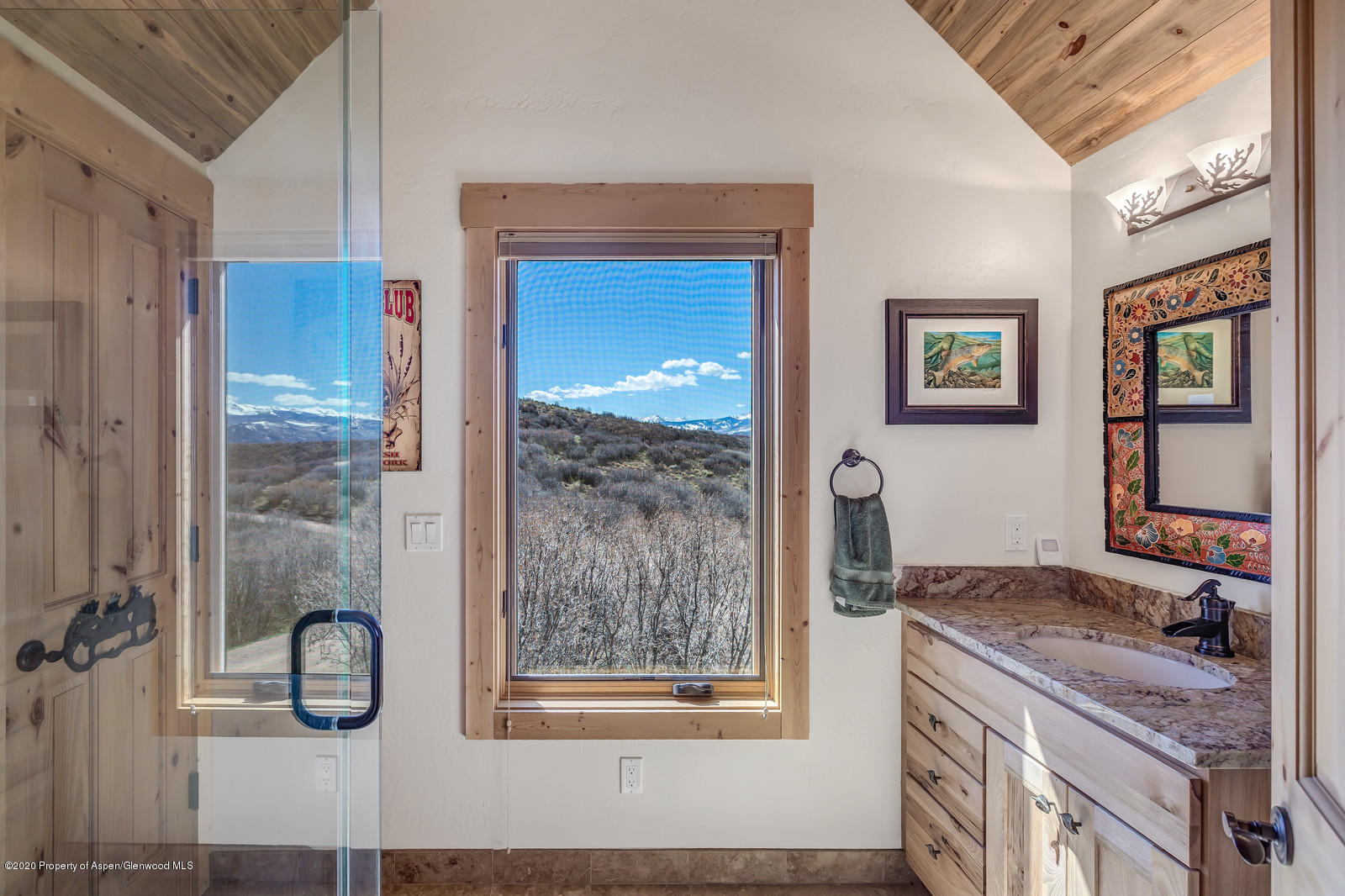 1121 Spring Park Road Carbondale, CO 81623 - Photo 22 of 41 a bathroom with a granite countertop tub and a shower