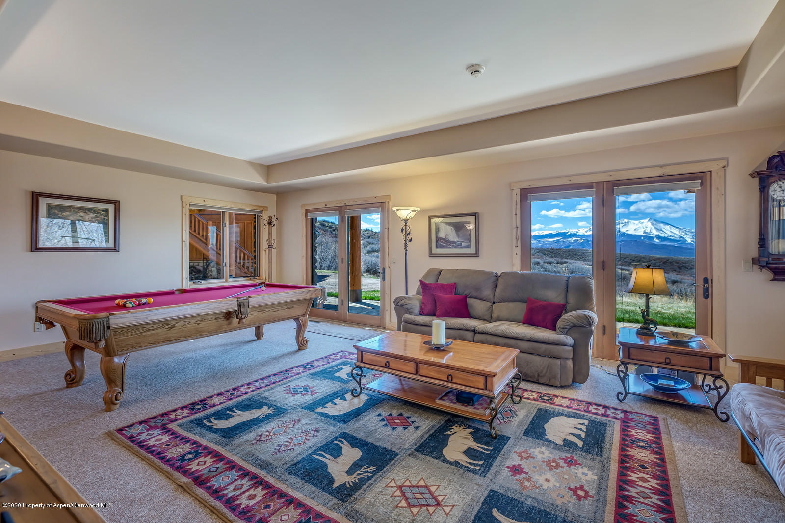 1121 Spring Park Road Carbondale, CO 81623 - Photo 28 of 41 a living room with furniture a rug and a window