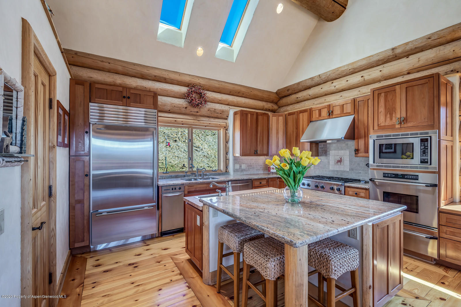 1121 Spring Park Road Carbondale, CO 81623 - Photo 7 of 41 a kitchen with stainless steel appliances granite countertop a refrigerator a stove and a sink