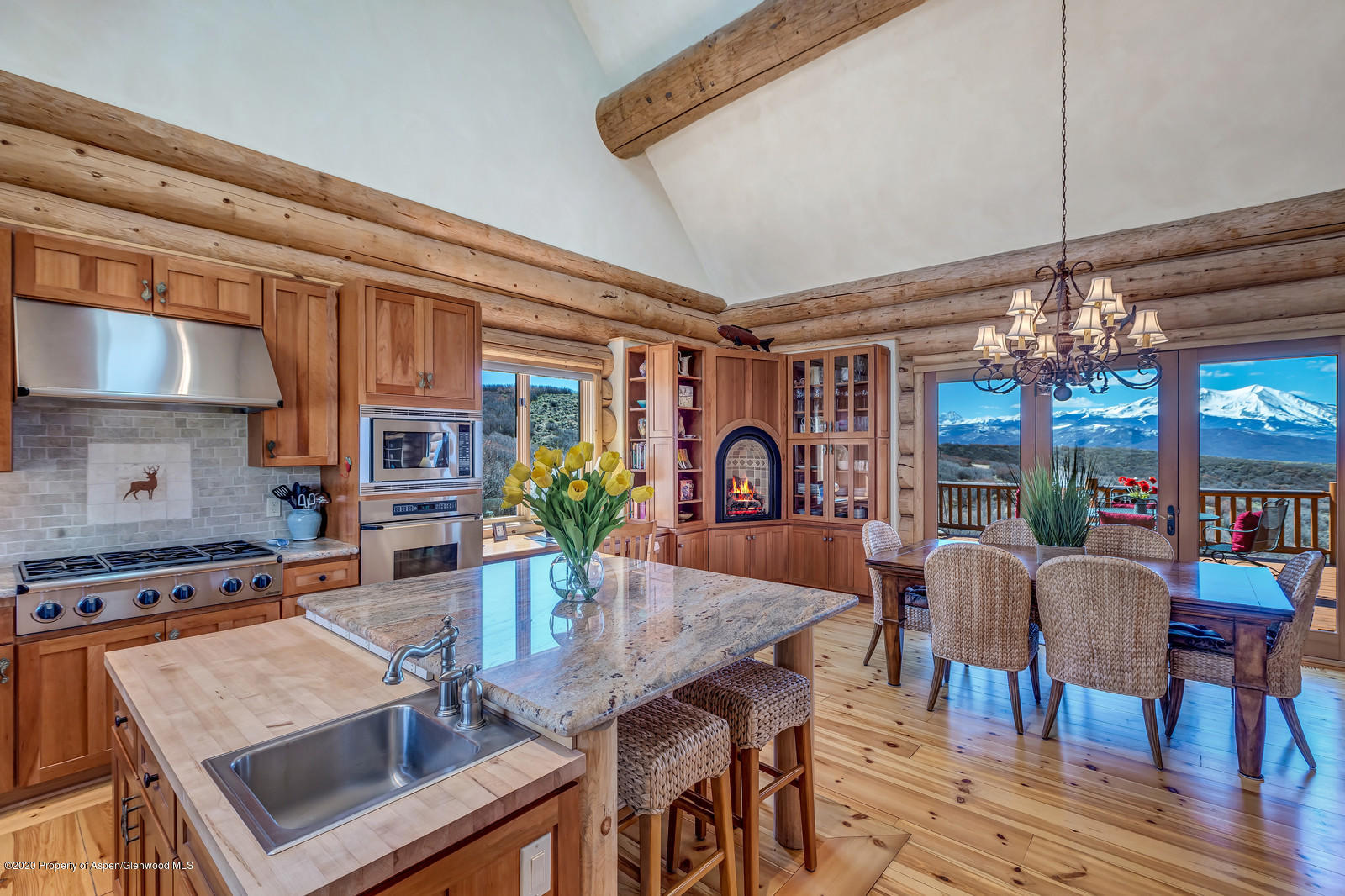 1121 Spring Park Road Carbondale, CO 81623 - Photo 8 of 41 a view of a dining room with furniture a chandelier and wooden floor