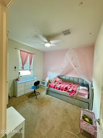 a bedroom with furniture and a bed