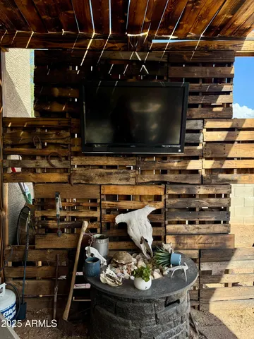 a room with furniture and flat screen tv