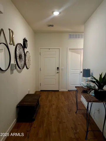 a view of a livingroom with furniture and mirror