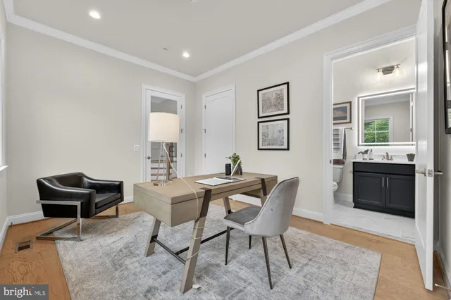 a view of a livingroom with furniture and stairs