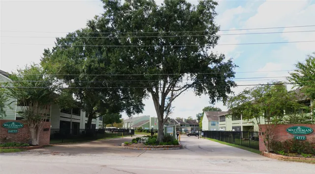 a couple of palm trees in front of house