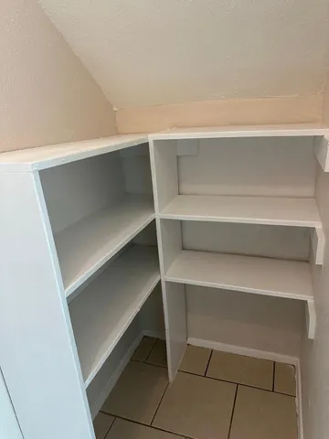 a close view of closet and wooden floor