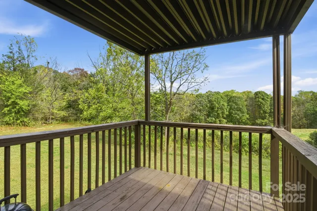 a view of a balcony with wooden floor