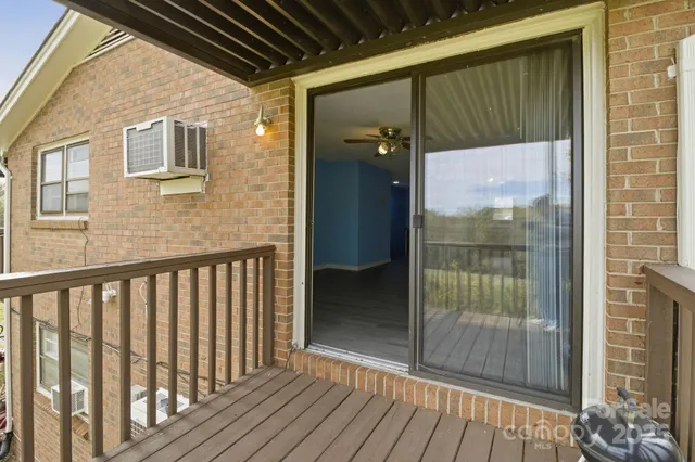 a view of a balcony with wooden floor