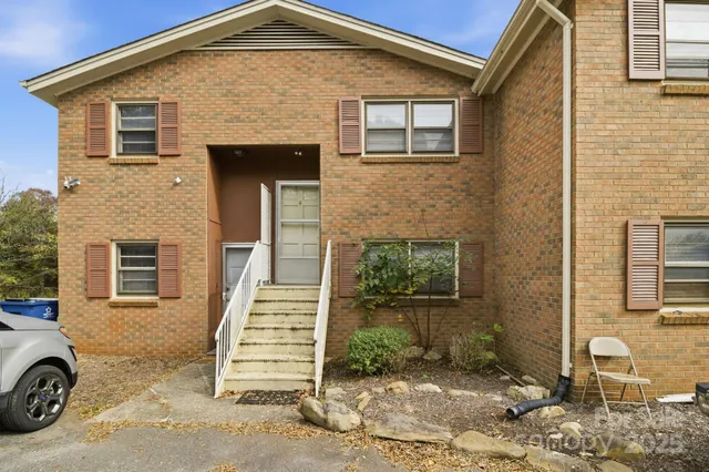 a front view of a house with stairs